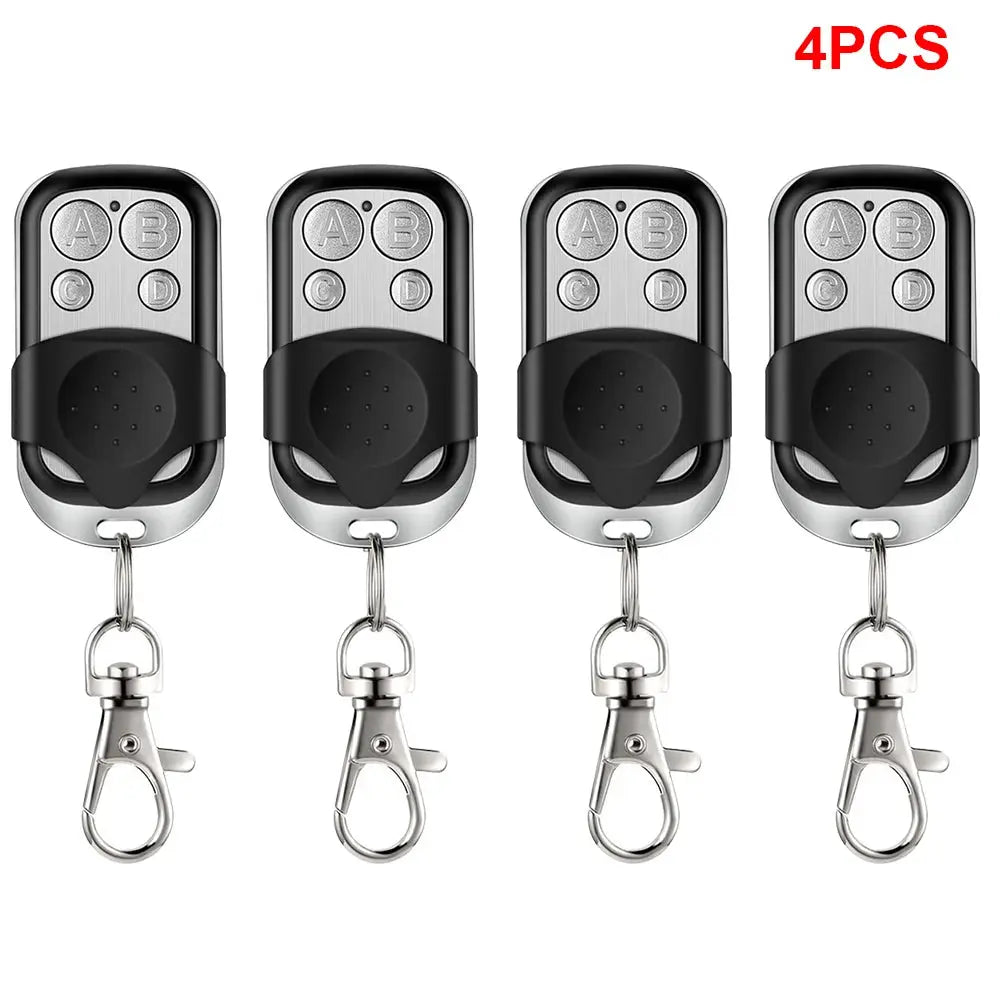 Universal 4-button garage door opener remote control set of 4 by Simples Market, black with silver tops