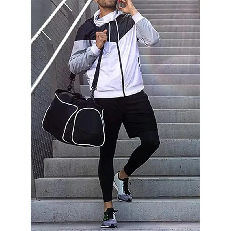 Men's 2-in-1 sport pants tracksuit with white and gray jacket and black leggings, shown with a black gym bag