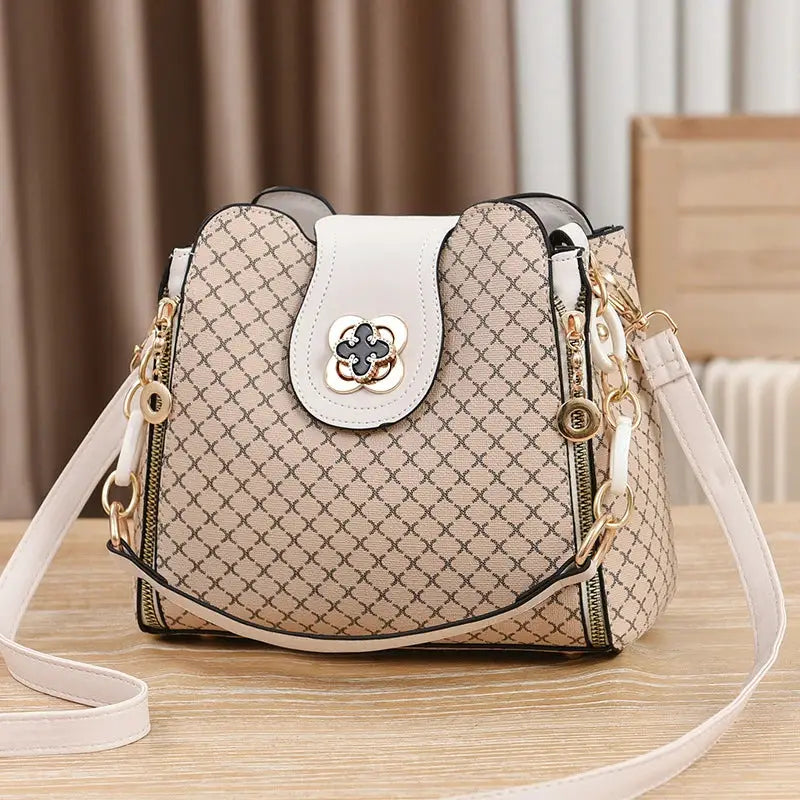 Simples Market women's handbag bucket crossbody in beige check print with white flap and gold hardware