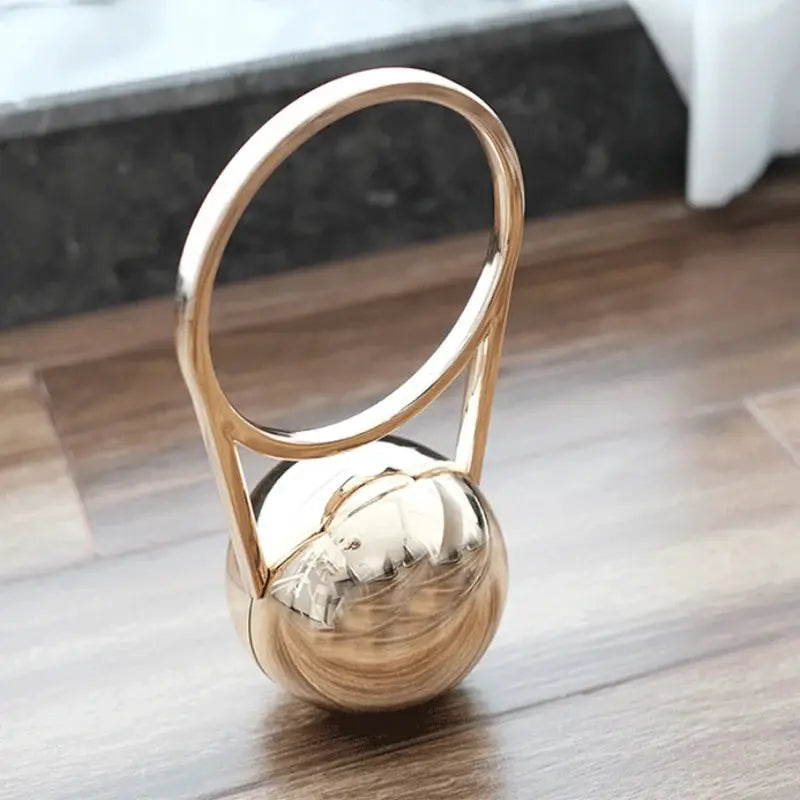 Gold-tone acrylic evening clutch with circular ball-handle ring, luxury party handbag