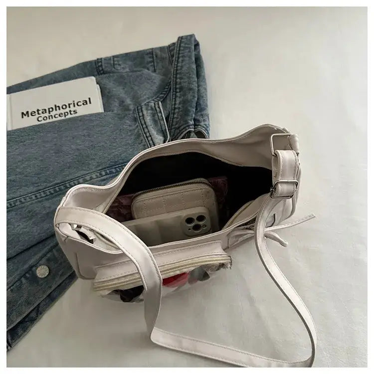 Beige Y2K Harajuku ita bag crossbody with adjustable strap; interior shows a smartphone