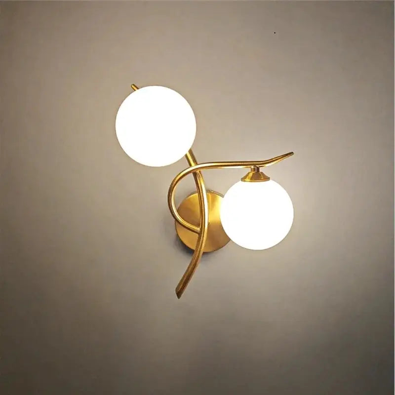 Nordic modern iron wall lamp with brass finish and two frosted glass globes