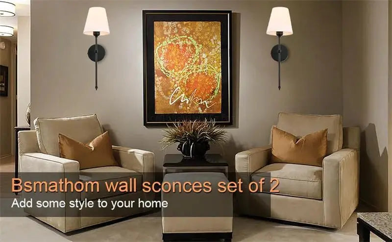 Pair of modern American wall sconces with white cloth shades and dark metal mounts.