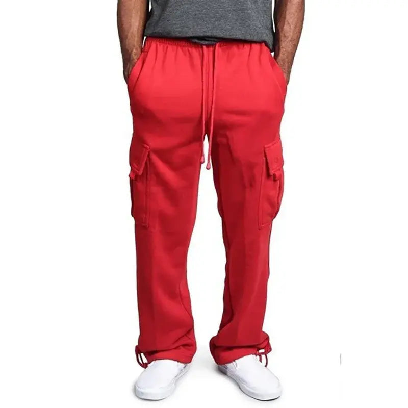 Men's red cargo sweatpants with drawstring waist, cargo pockets, and cinched ankles.