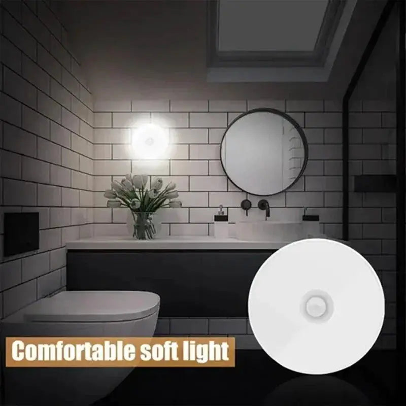 Motion sensor night light, white circular USB-rechargeable LED lamp for kitchen, bathroom, hallway.