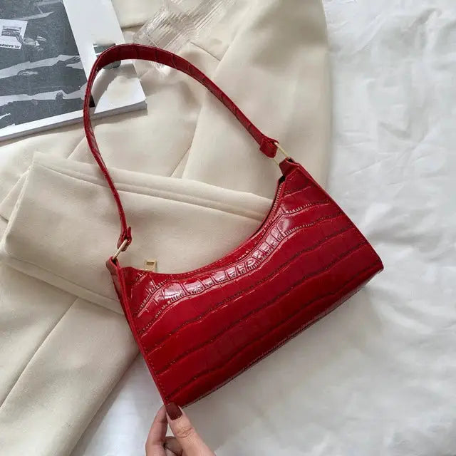 Underarm handbag in red crocodile-embossed PU leather with gold hardware and short strap