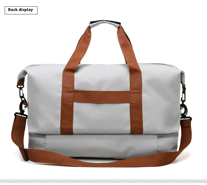 Large capacity travel gym bag in light gray with brown handles and detachable shoulder strap