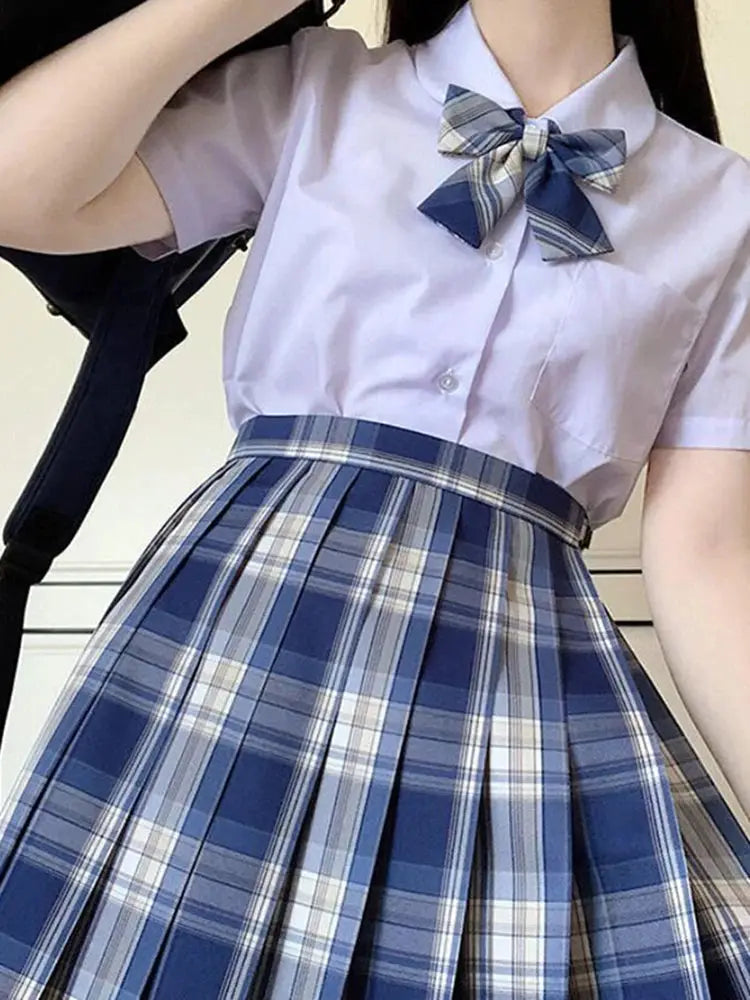 ZOKI plaid women's pleated high-waist skirt in blue plaid, paired with a light purple blouse and bow.