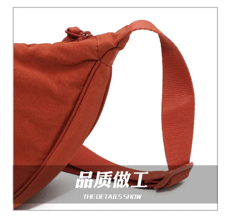 Casual nylon hobo crossbody bag in orange with a wide shoulder strap for women