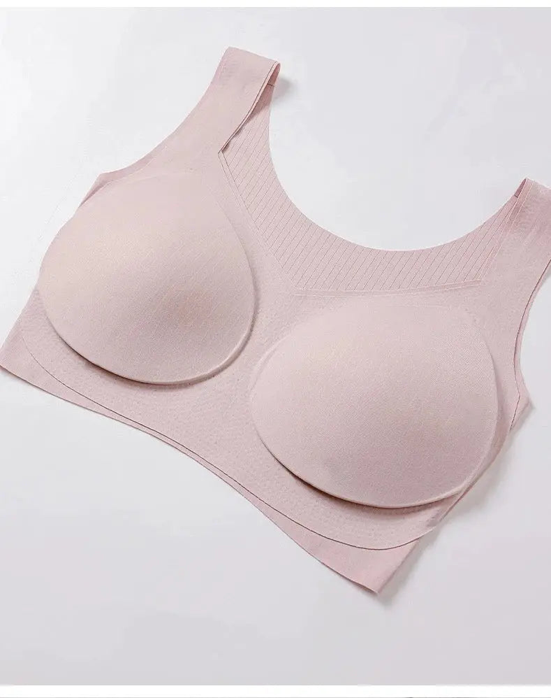 Pink seamless longline bra with molded cups and wide ribbed back for a traceless, comfortable fit.