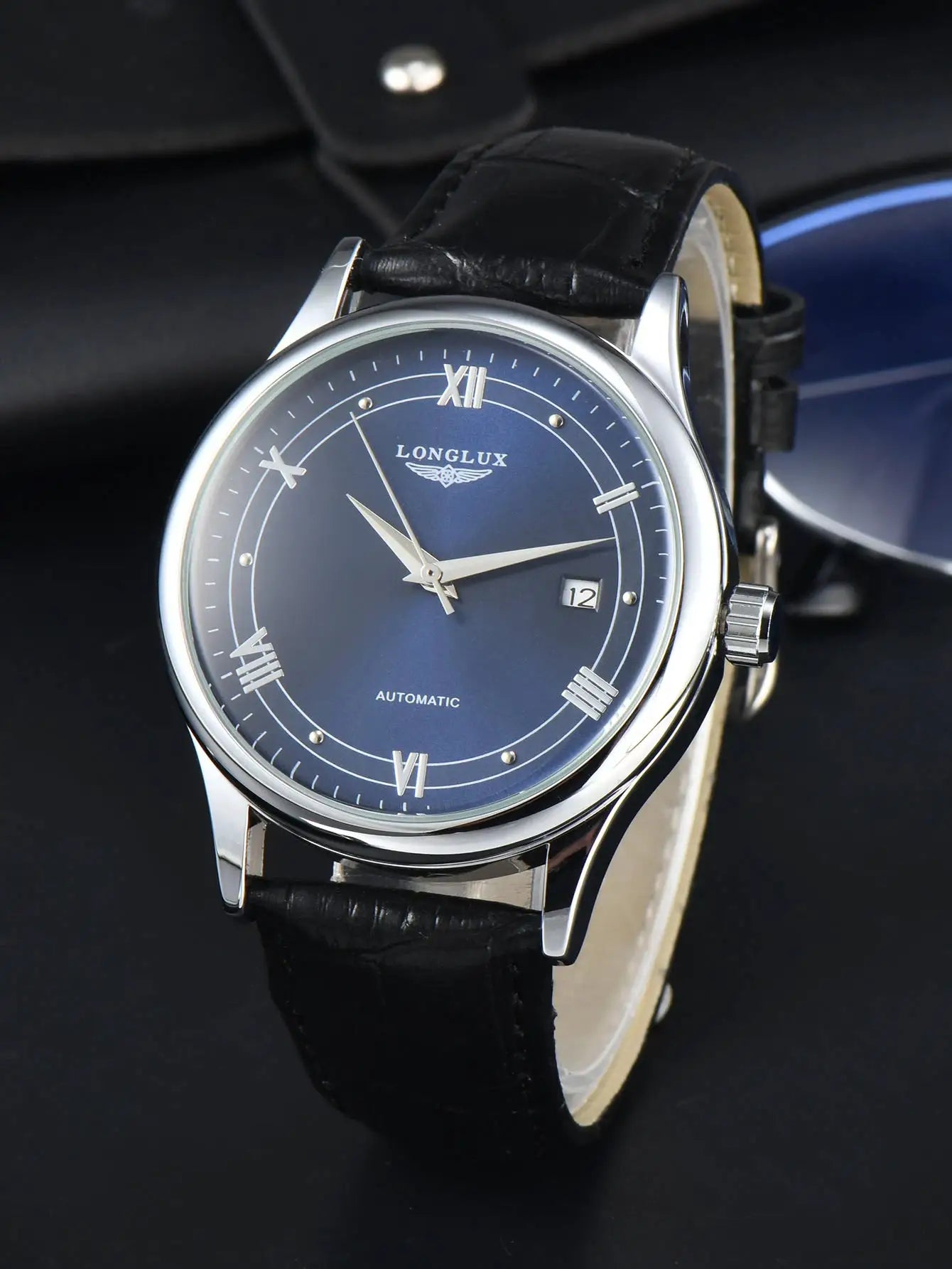 LONGLUX automatic men's wristwatch with blue dial, silver case and black leather strap, date display