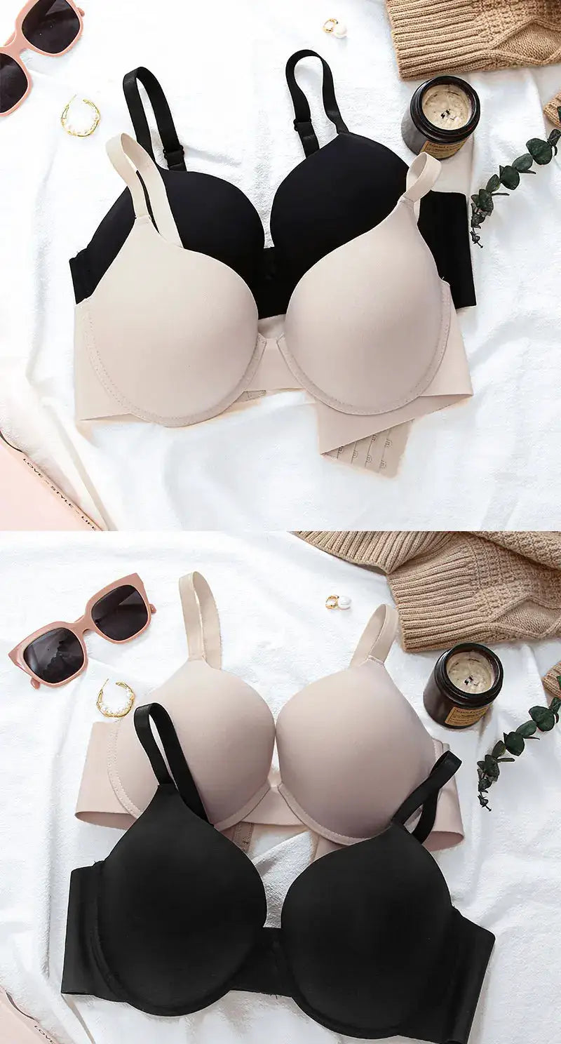 2-piece set of wireless push-up bras in beige and black with adjustable straps and deep-V neckline