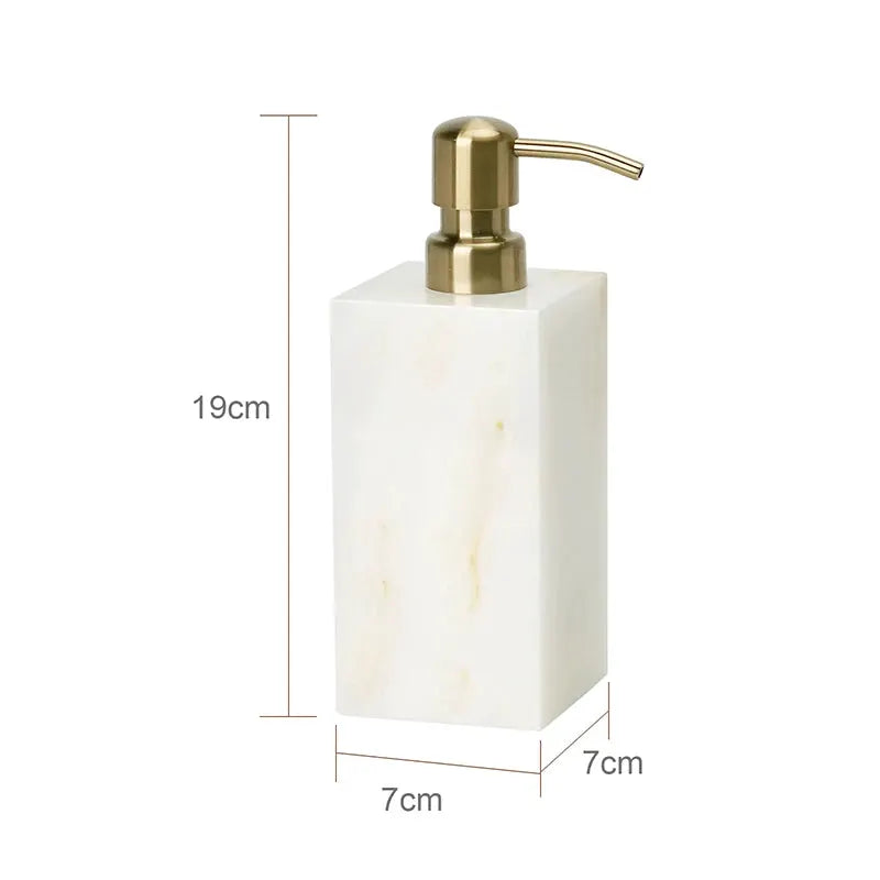 Soap dispenser from Simples Market in white onyx marble with brass pump.