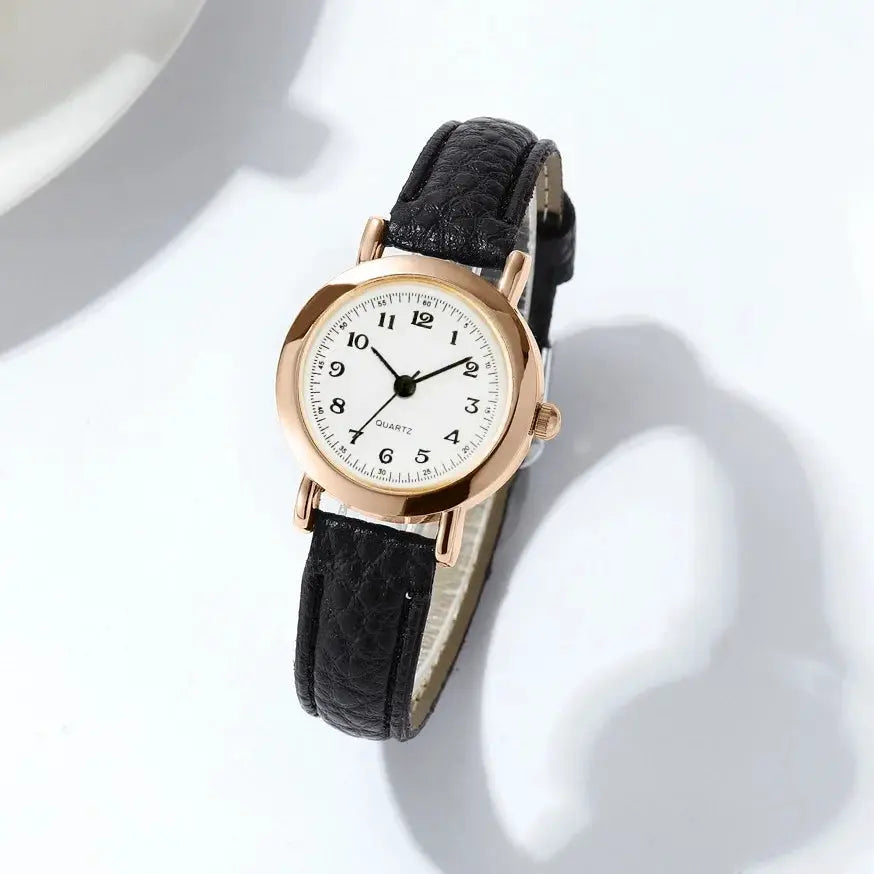 Women's wristwatch by Simples Market with black leather strap and rose-gold case
