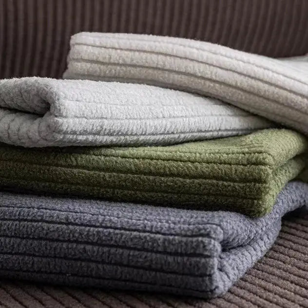 Simples Market sofa cushion covers in gray, white and olive tones, folded plush fabric