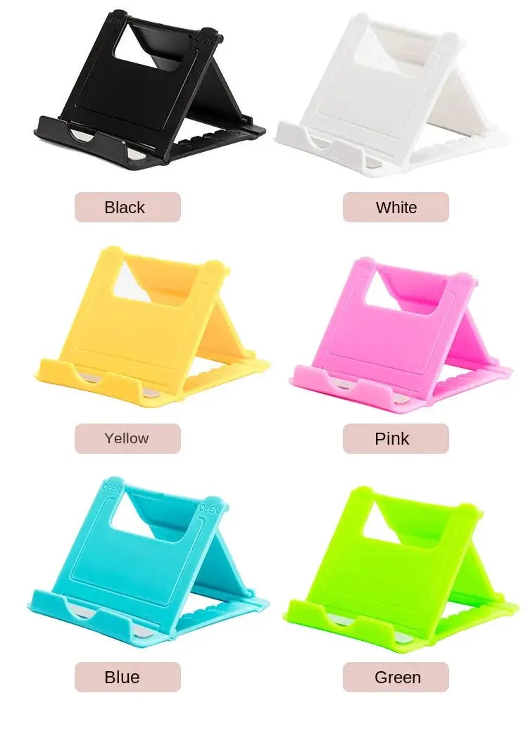 Desktop Lazy Mobile Tablet Folding Stand by Simples Market; six stands in black, white, yellow, pink, blue, and green.