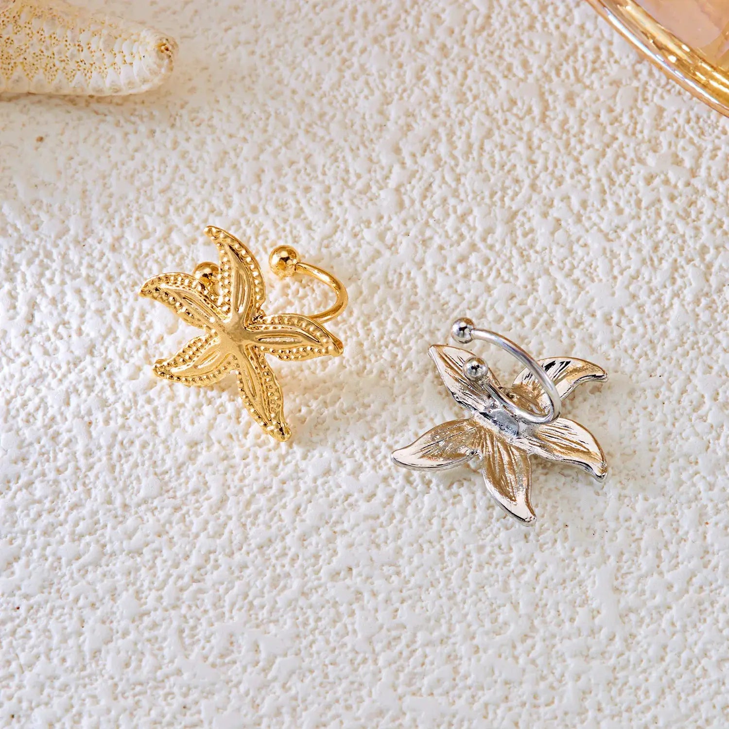 Starfish ear clips set in gold and silver; faux piercing earrings for women, boho beach jewelry (2 pcs)