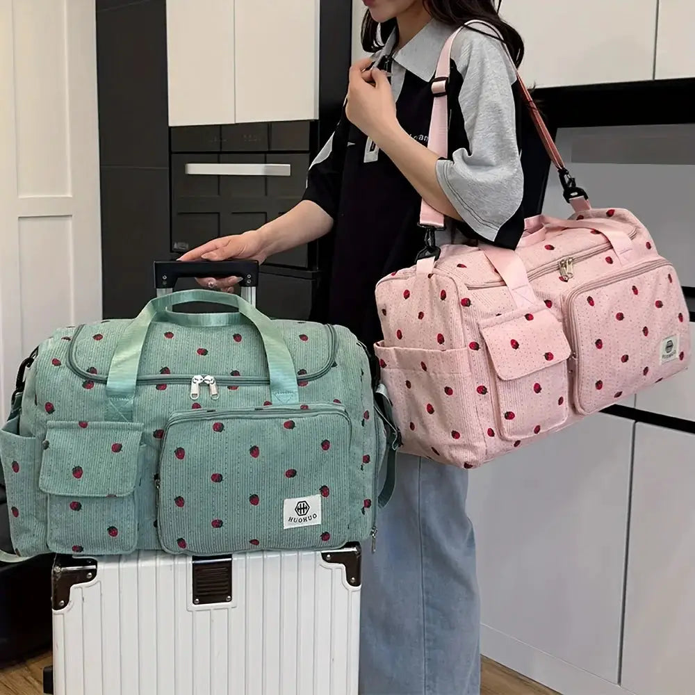 Strawberry travel bag set with two bags: mint green and pink corduroy duffle bags with multiple pockets and large capacity