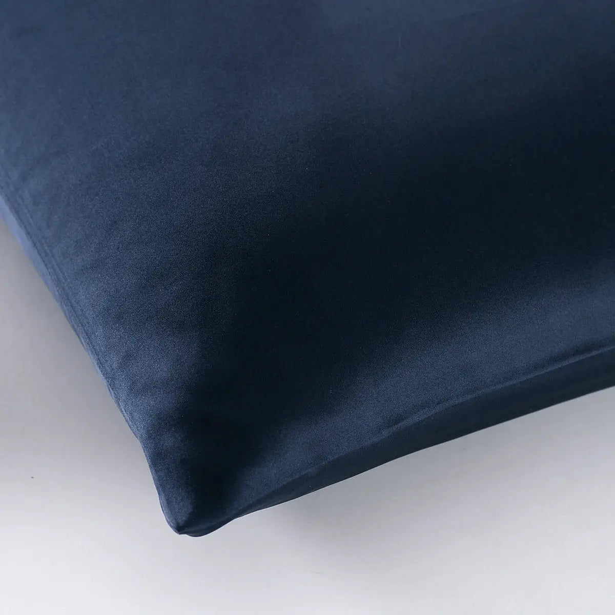 Silk pillowcase with zipper, navy blue, close-up corner view
