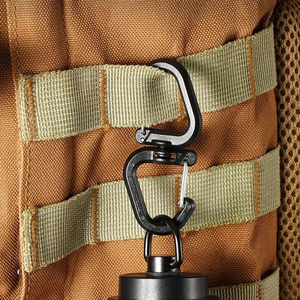 Double clip carabiner with 360° swivel in black metal on tan tactical backpack strap