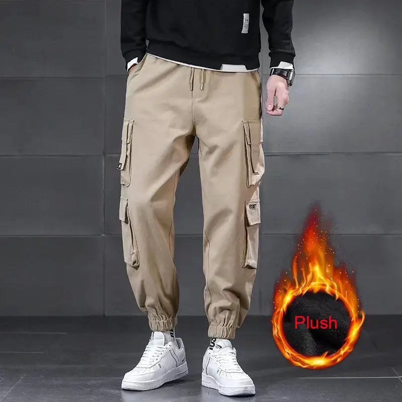 Beige men's winter lambswool waterproof cargo pants with multiple pockets, drawstring waist, and elastic cuffs