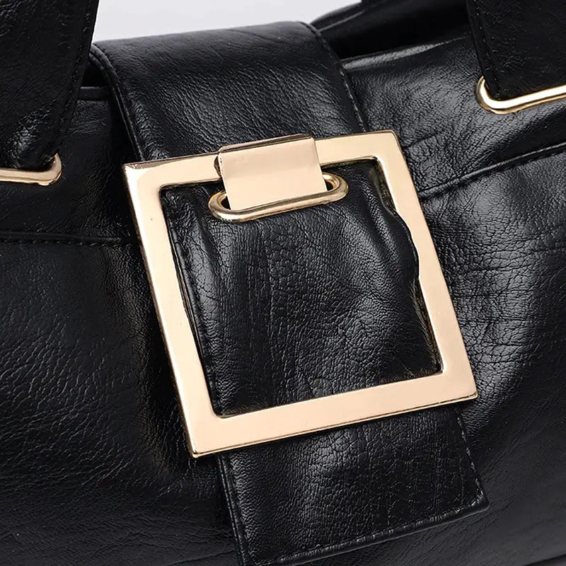 Women’s black leather top-handle bag with gold-tone square buckle