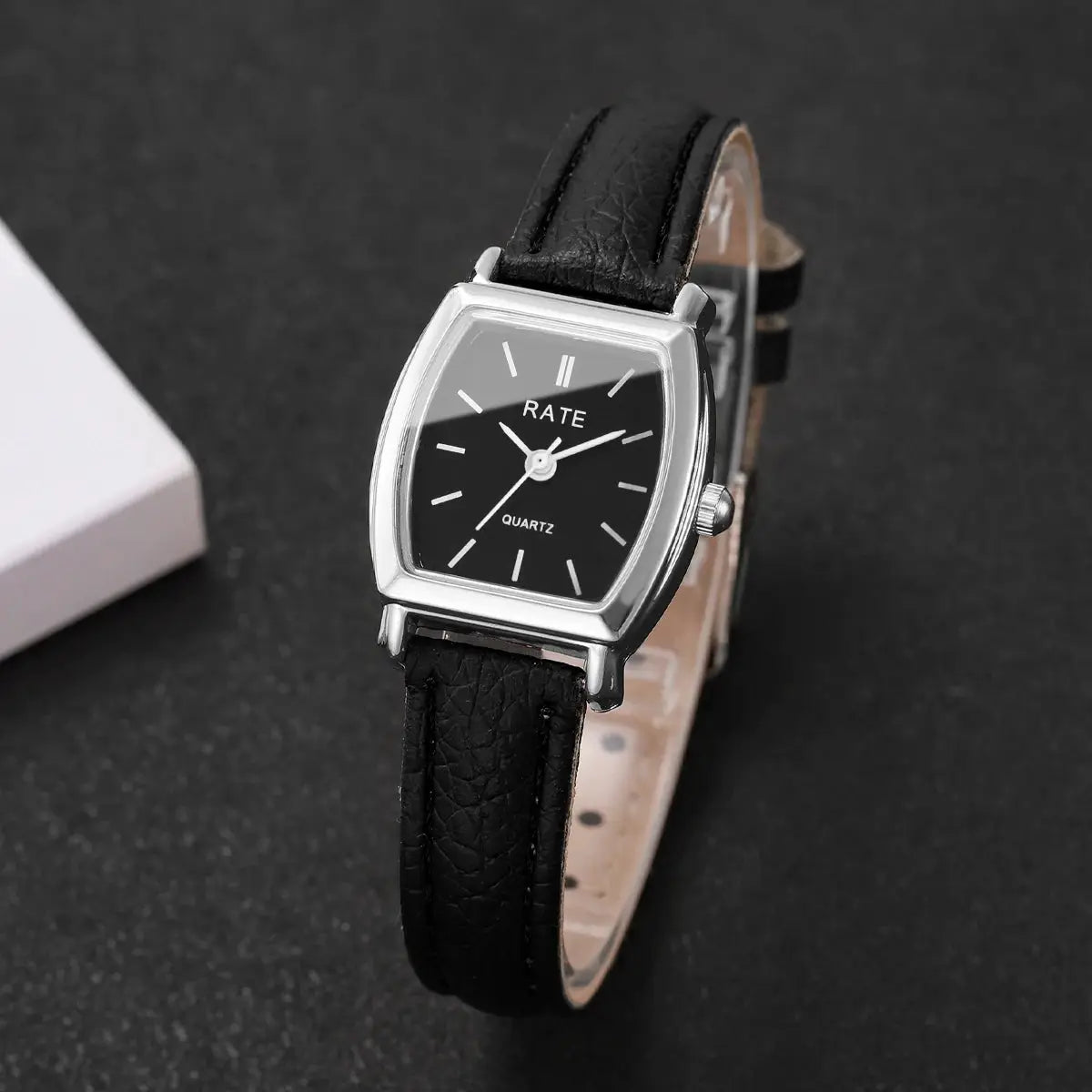 Women's quartz wristwatch with black dial and black leather strap