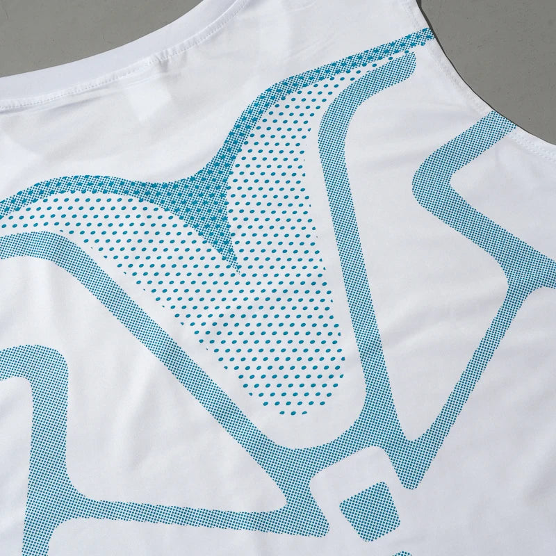 Men's sports compression vest white fabric with teal dotted print close-up.