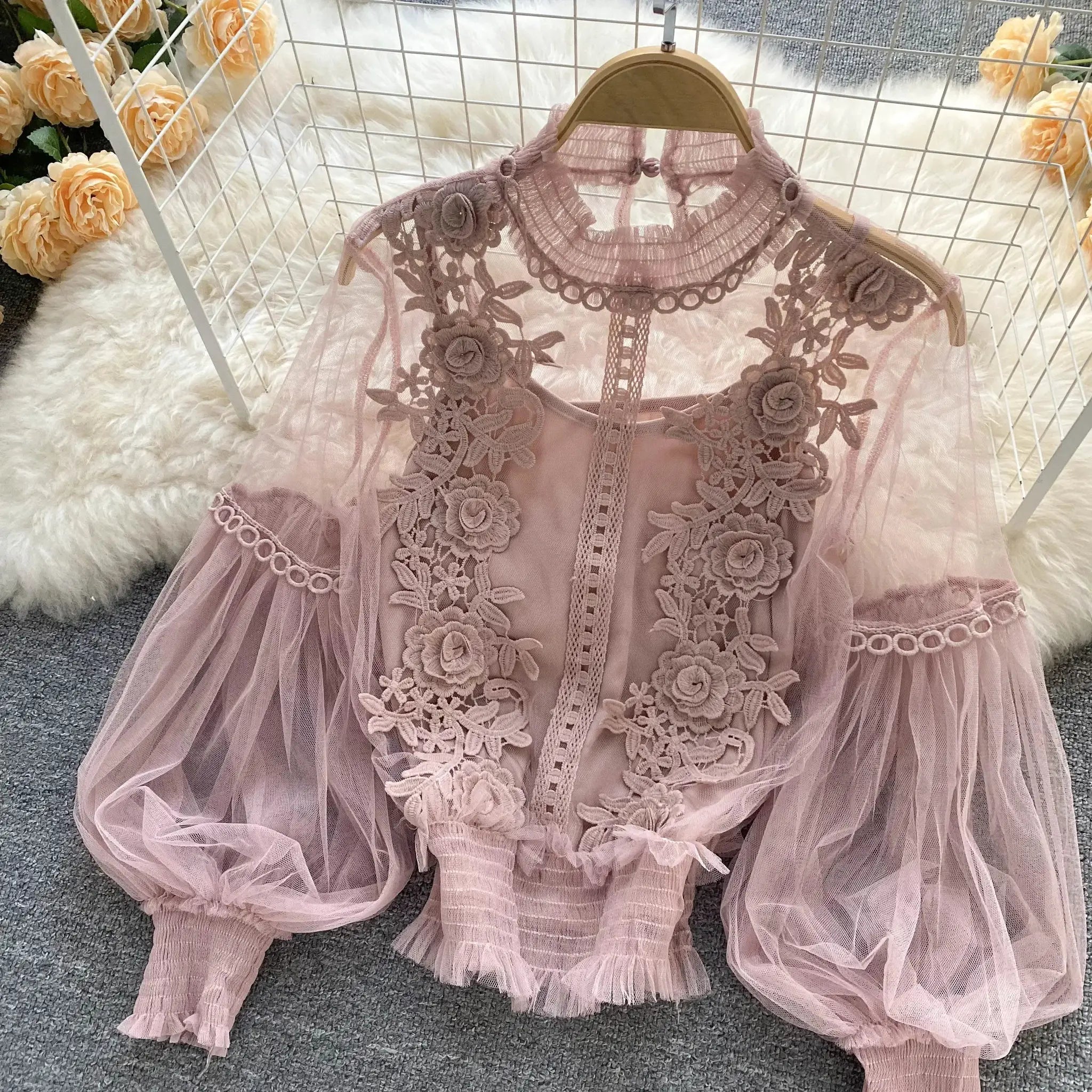 Lace puff long-sleeve blouse in dusty pink with floral appliqué and sheer mesh.