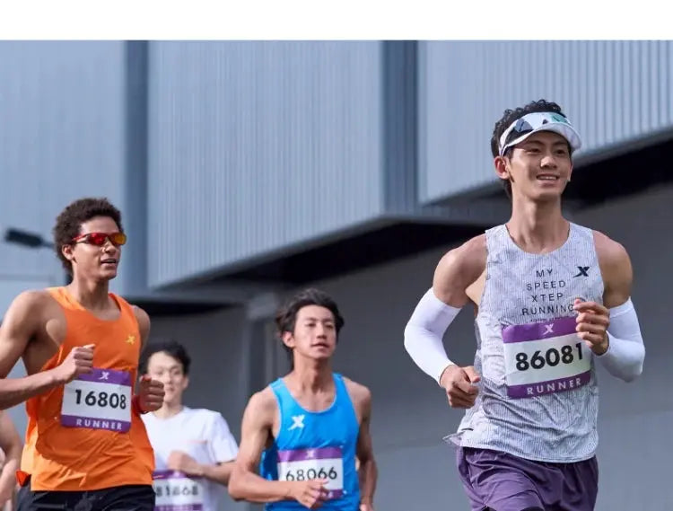 Xtep Shyft 1.0 men’s running shoes; group of four runners in colorful athletic gear at a marathon.