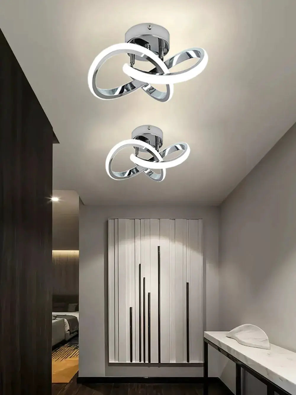 Modern LED ceiling light fixtures with chrome intertwined loop design; surface-mounted hallway lights, two units