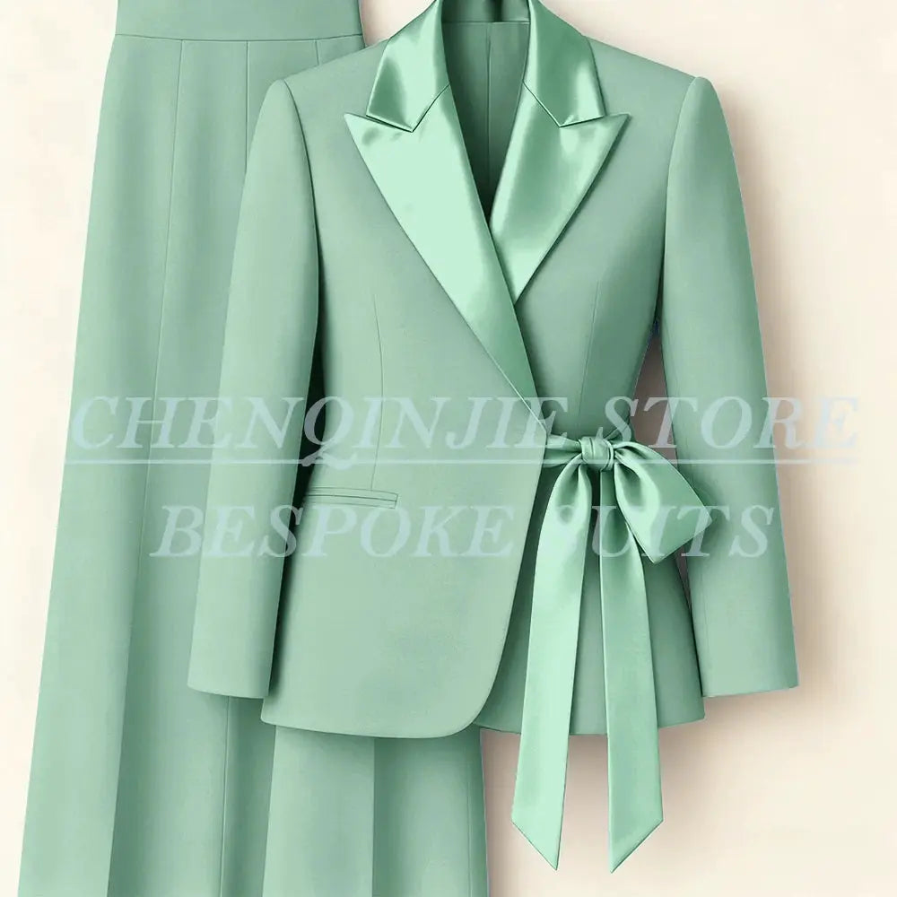 Women's mint green 2-piece blazer and pants suit with satin peak lapels and waist tie
