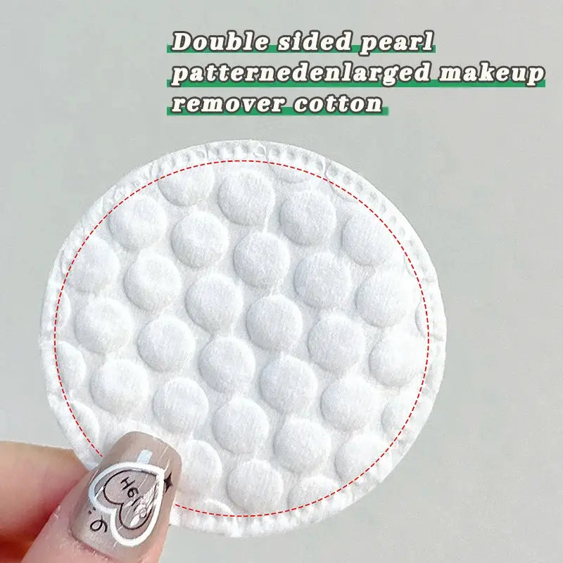 Round cotton pad by Simples Market with double-sided pearl texture for makeup removal