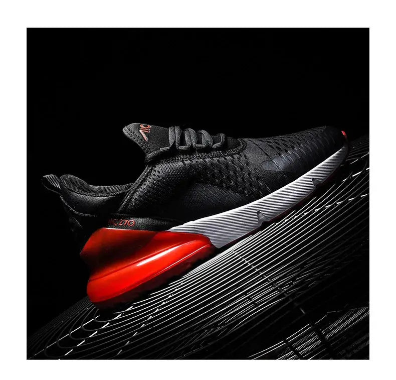 Men's black running sneakers with red heel, white midsole, and breathable mesh upper