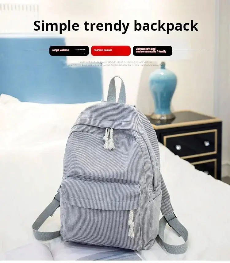 Personalized corduroy student backpack in light gray with front pocket and tassel drawstring.