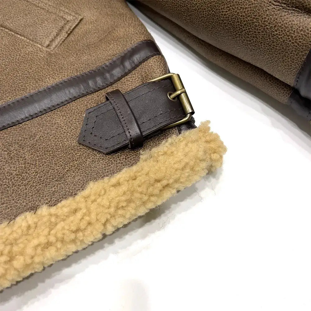 Men's brown leather shearling jacket with beige wool lining and buckle strap