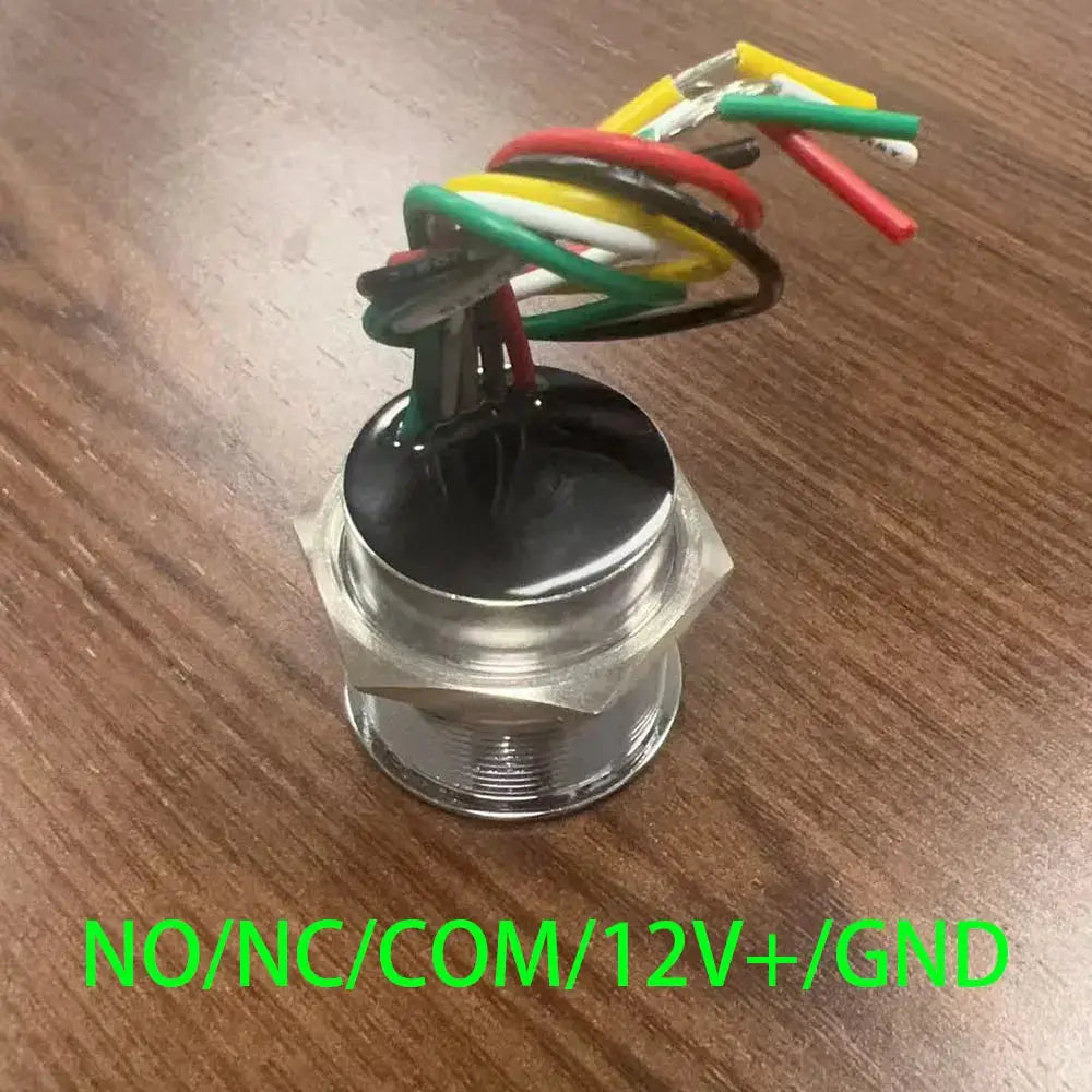 Round metal door exit push button with multicolored wiring harness and NO/NC/COM/12V+/GND terminals.