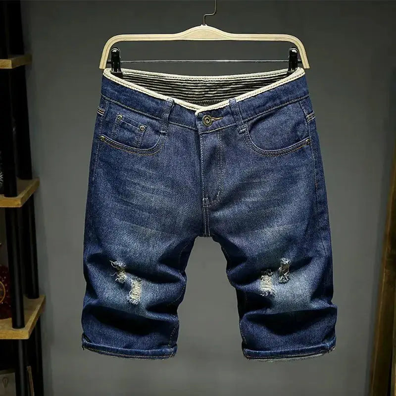 Men denim shorts in light blue with distressed knees, slim-fit style by Simples Market.