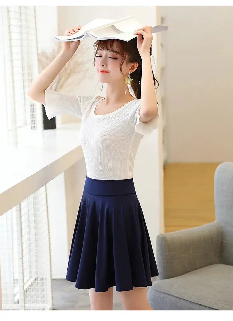 Flared navy blue skater skirt with white short-sleeve top