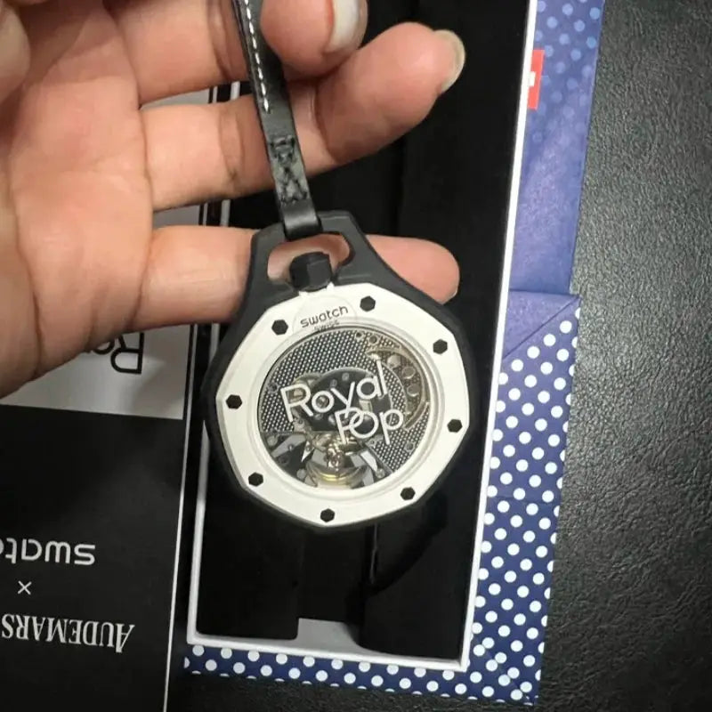 Royal Oak style wristwatch replica with black leather strap and transparent case back