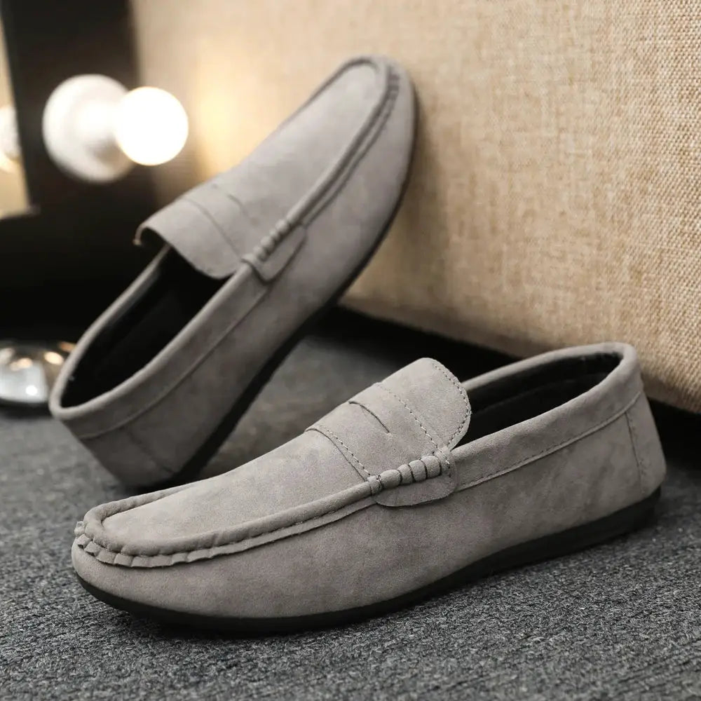 Casual men's gray suede driving loafers; slip-on moccasin with visible stitching