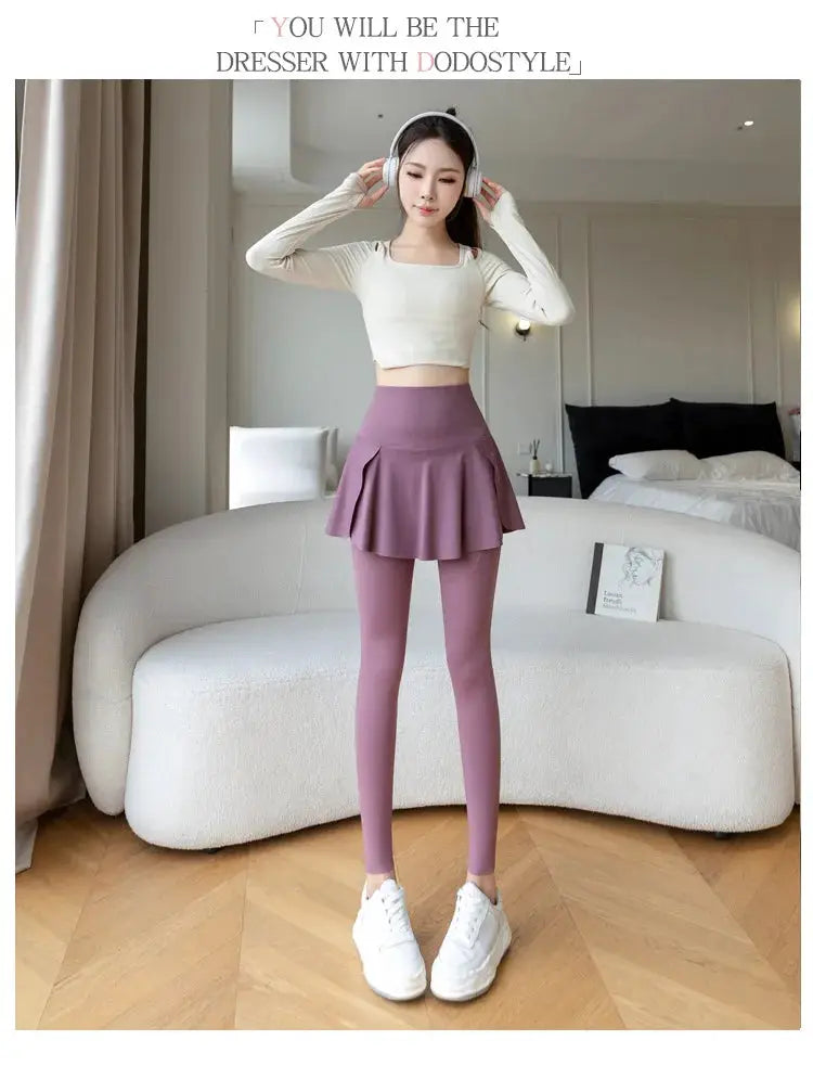 Women two-piece seamless high-waist leggings with pocket and attached lilac skirt.