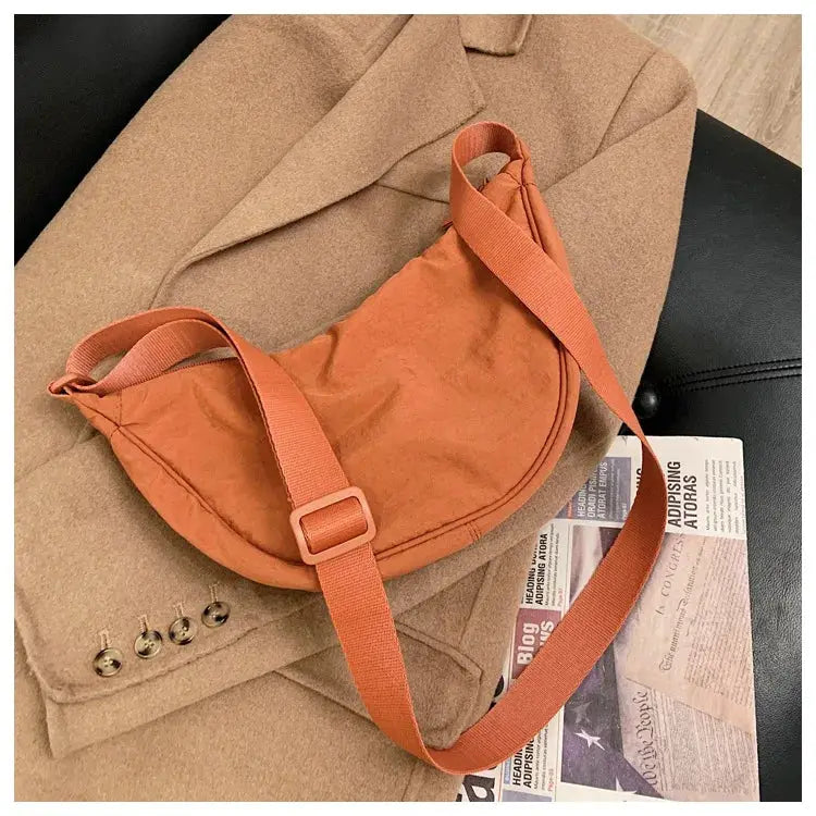 Casual nylon hobo crossbody bag in orange with adjustable strap