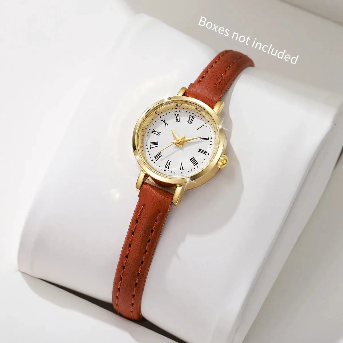 Women's leather-band quartz watch with gold-tone case, white Roman numeral dial, brown strap