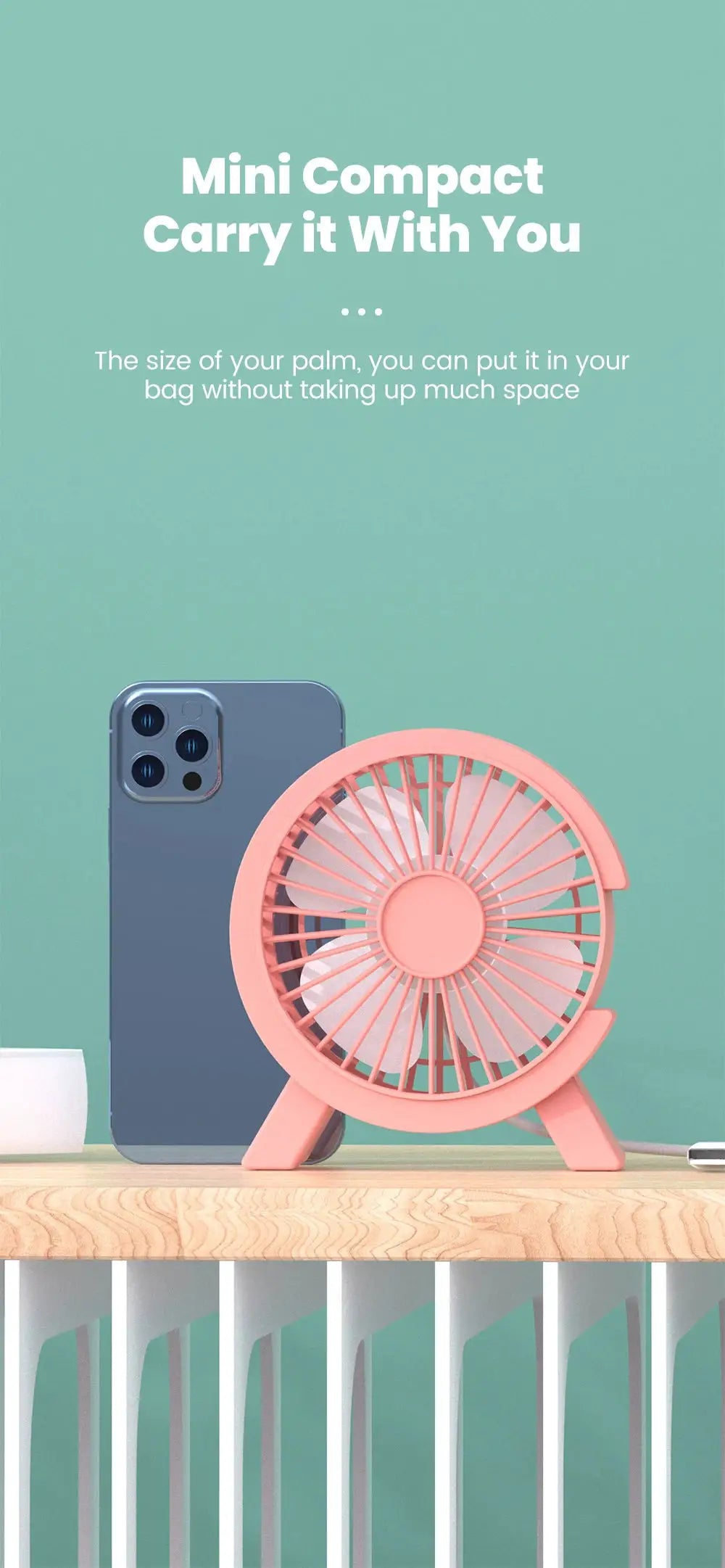 Mini USB desk fan, pink, and smartphone on a wooden desk (2 items)