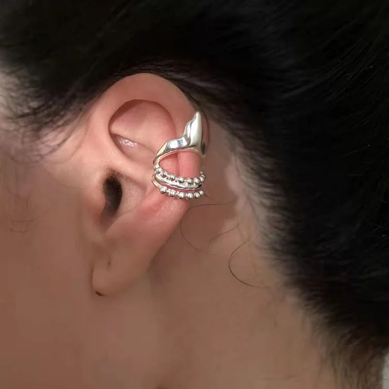 Elf ear clip earring; silver geometric cuff with beaded chain wraps around the ear