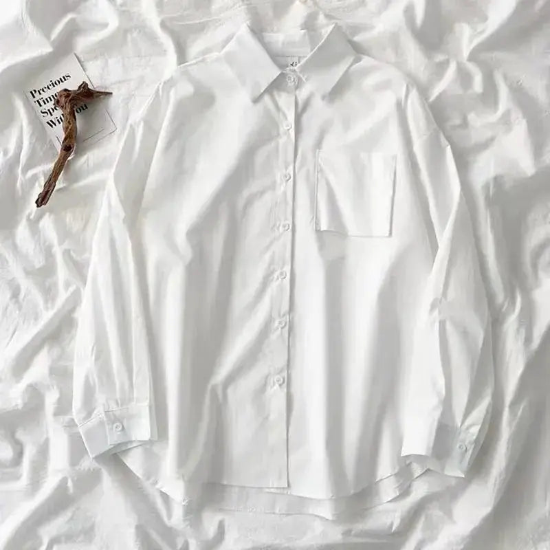 Simples Market white oversized women's long-sleeve shirt with chest pocket and turn-down collar