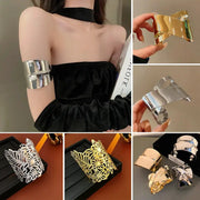 Metal cuff bracelet set for women in silver and gold tones; geometric multi-layer armbands and ornate filigree floral cuffs.