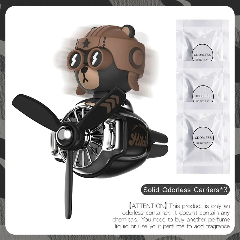Car air freshener vent clip by Simples Market: brown pilot bear on black engine pod with 3 odorless carriers