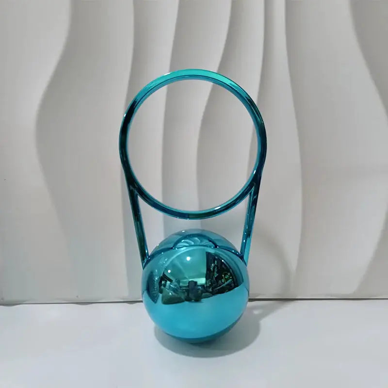 Simples Market turquoise acrylic evening clutch with ball-handle circular frame